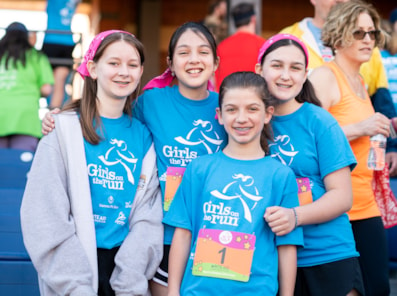 Four Girls on the Run participants smile at the 5K